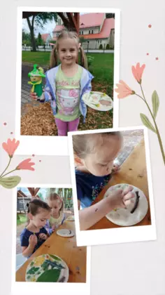 Dzieci z pracą plastyczną włóczykijem wykonanym z rolki papieru.